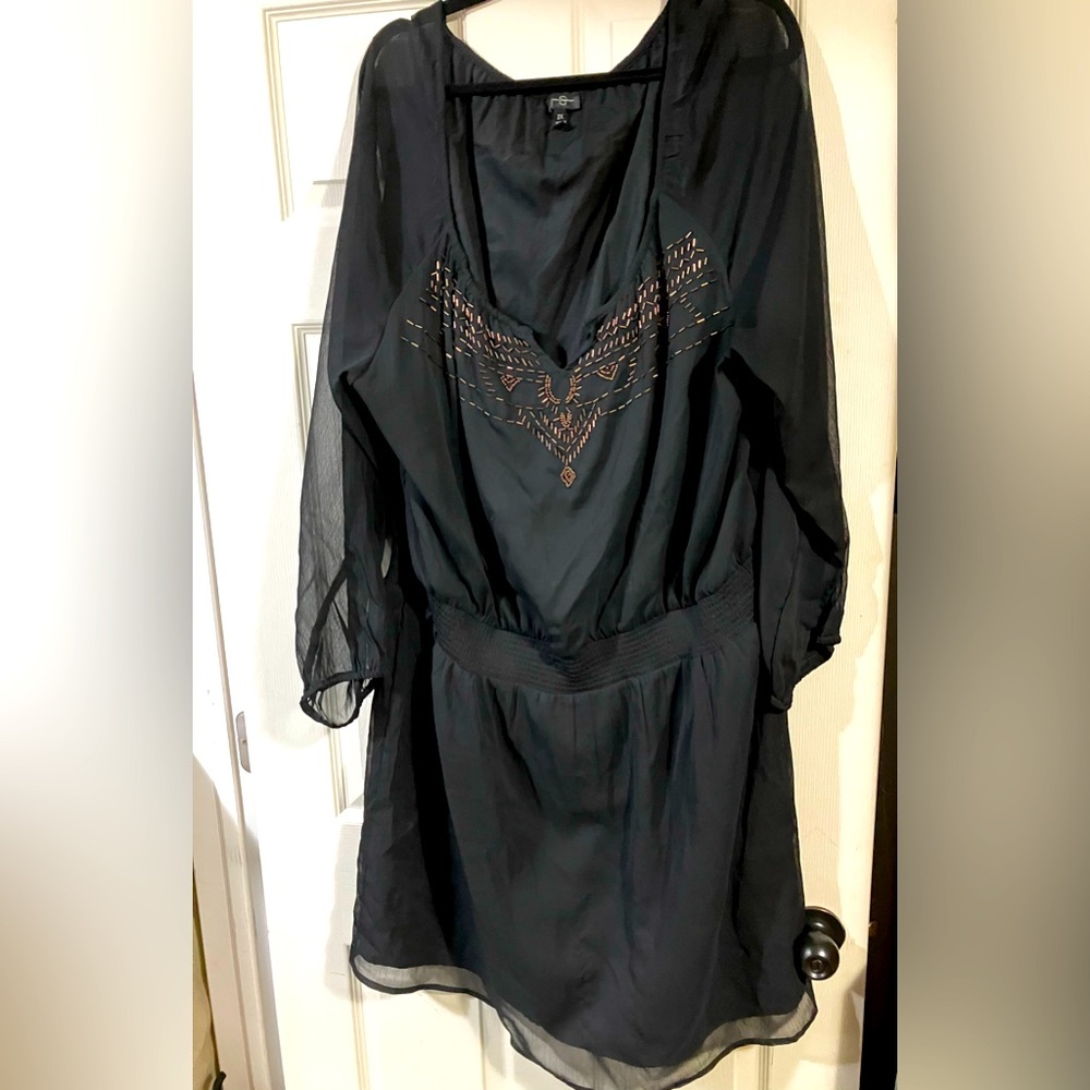Beaded with copper coloured beads on a flowing black dress